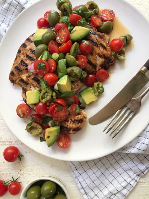 grilled chicken with tomatoes, olives, and avocado